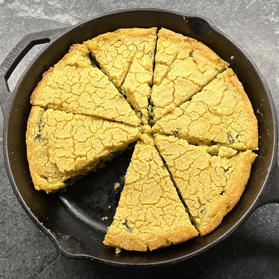 cornmeal pie on a cast iron skillet looking delicious